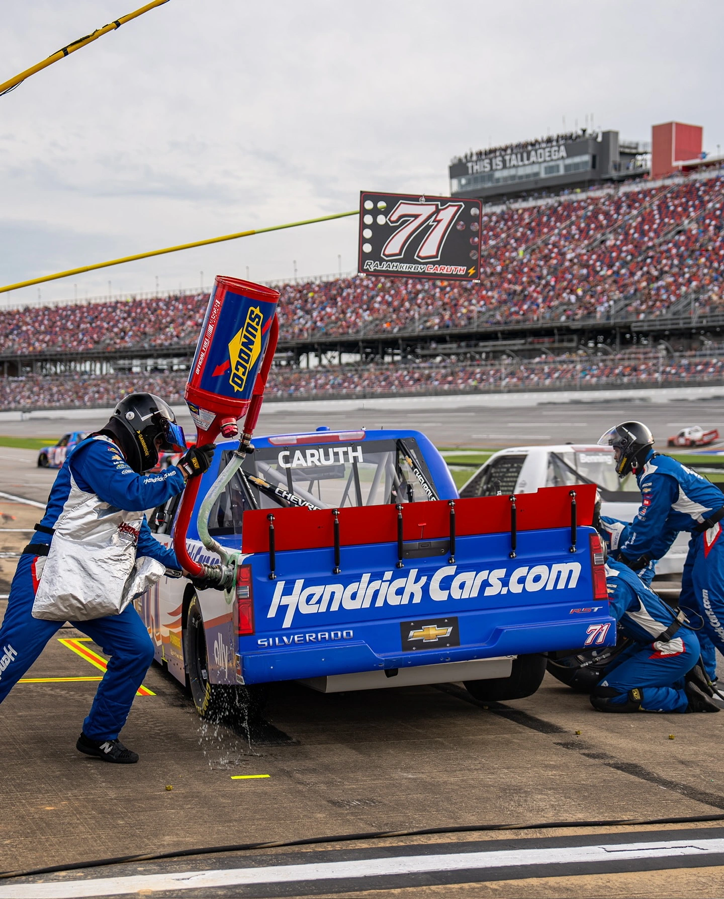 Race car getting fueled at NASCAR race