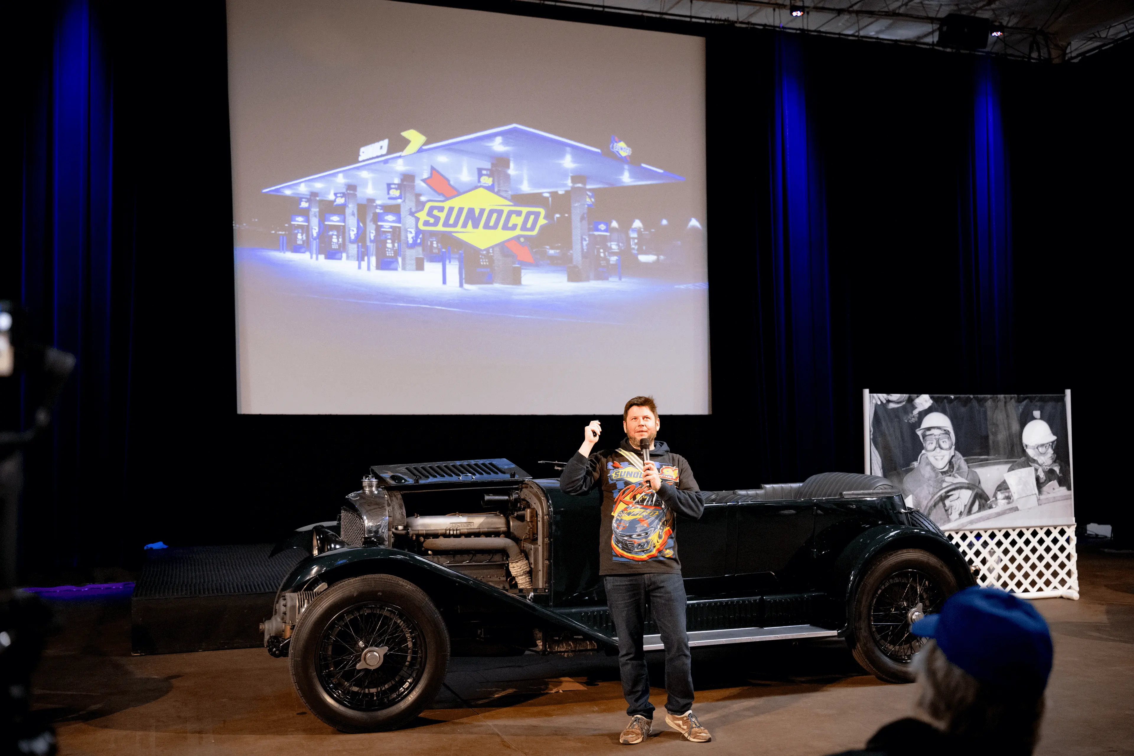 Men presenting at museum
