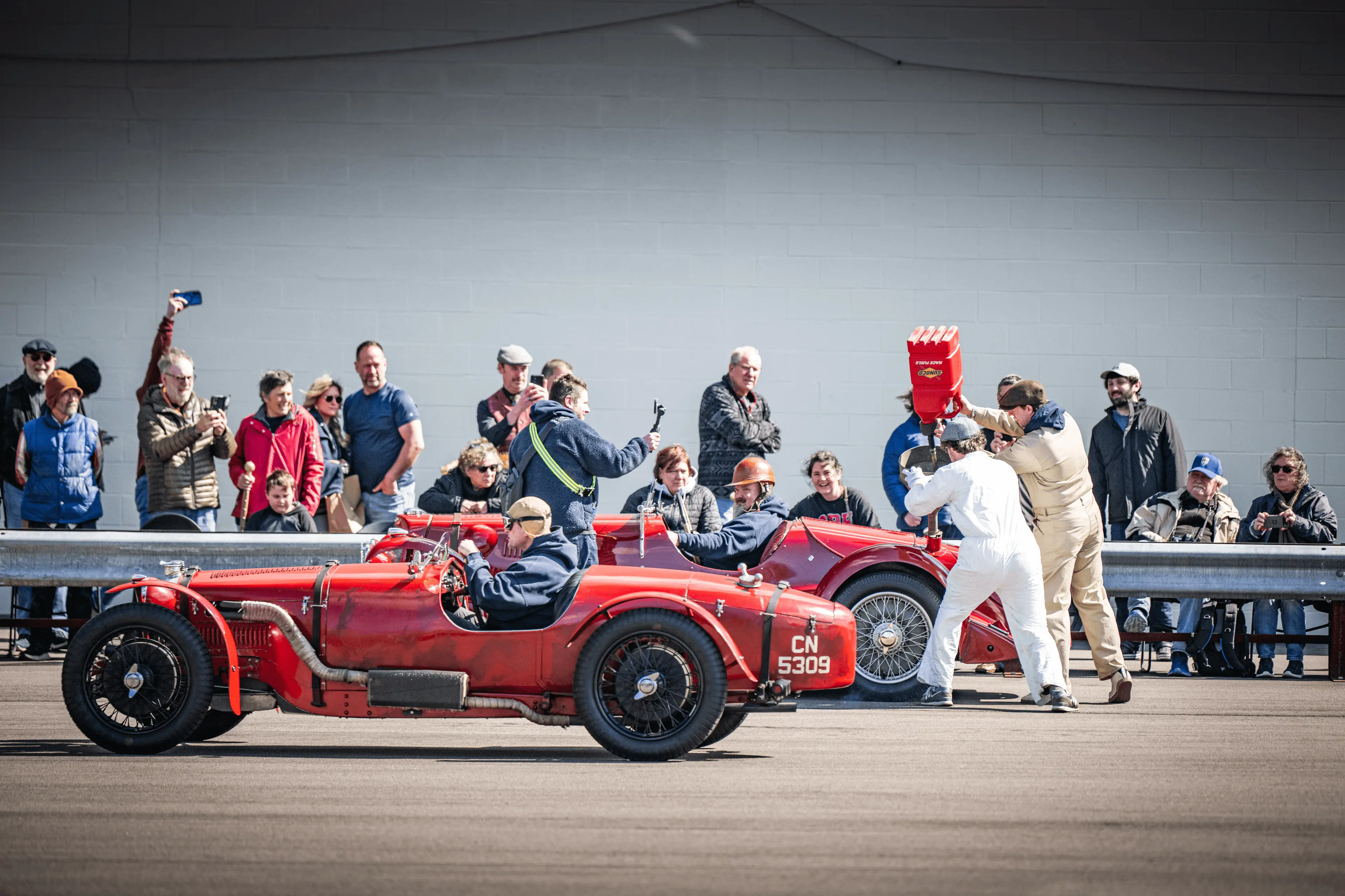 Demo of historic race cars being fueled