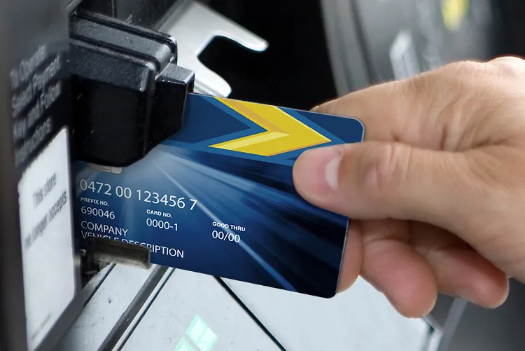 Male hand inserting card at fuel pump