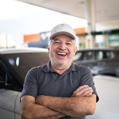 Man smiling at gas station