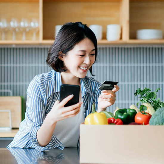 Woman holding grocery card