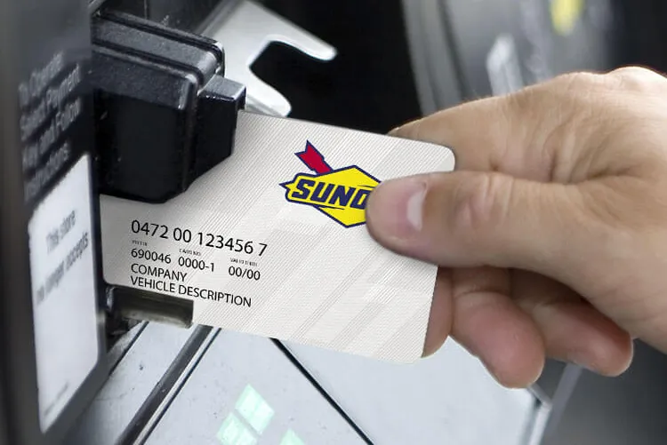 Man with card at pump