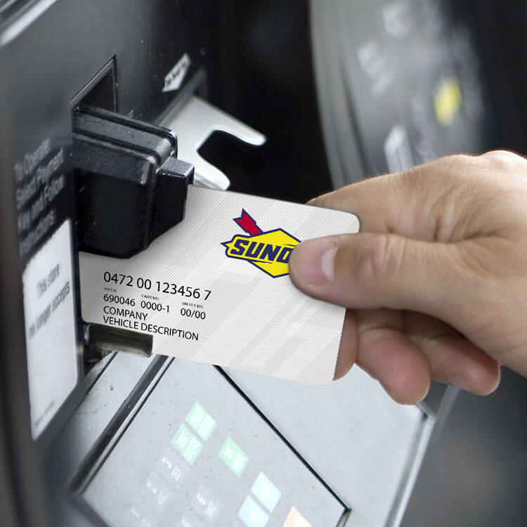 Man with card at pump