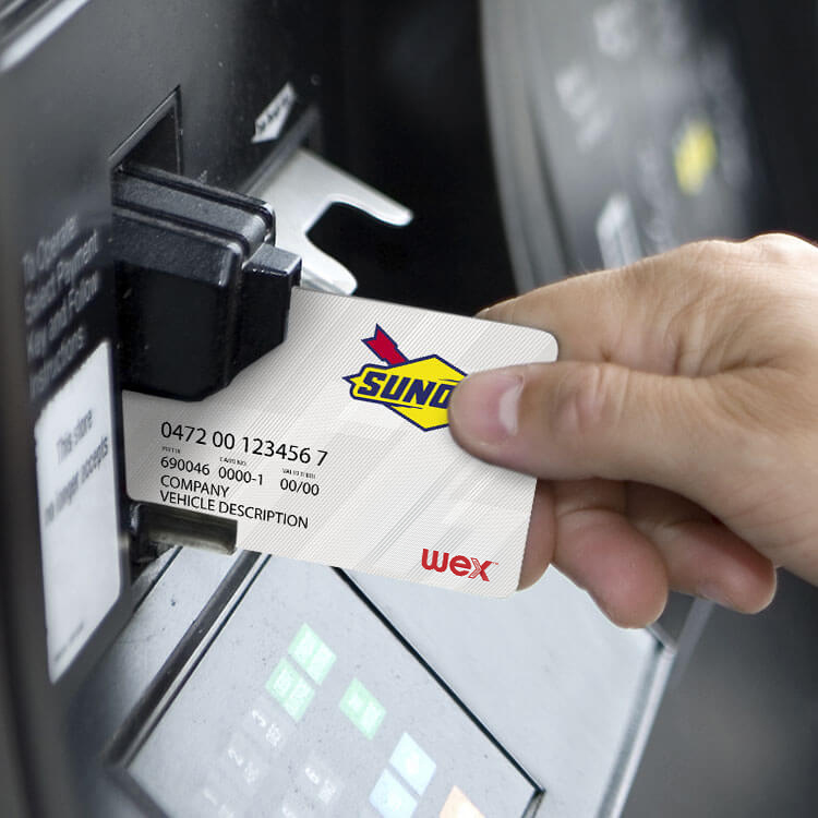 Man with card at pump